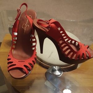 Jessica Simpson high-heeled sandals. (Coral)